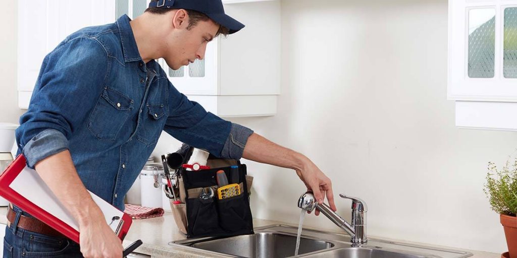 home inspector checking the plumbing system