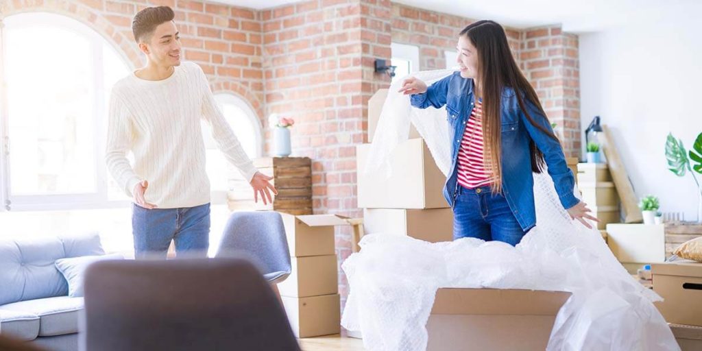 people packing with bubble wrap