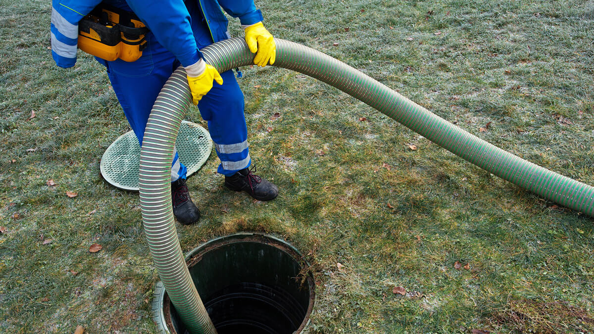 cleaning the septic tank of a rural house for sale