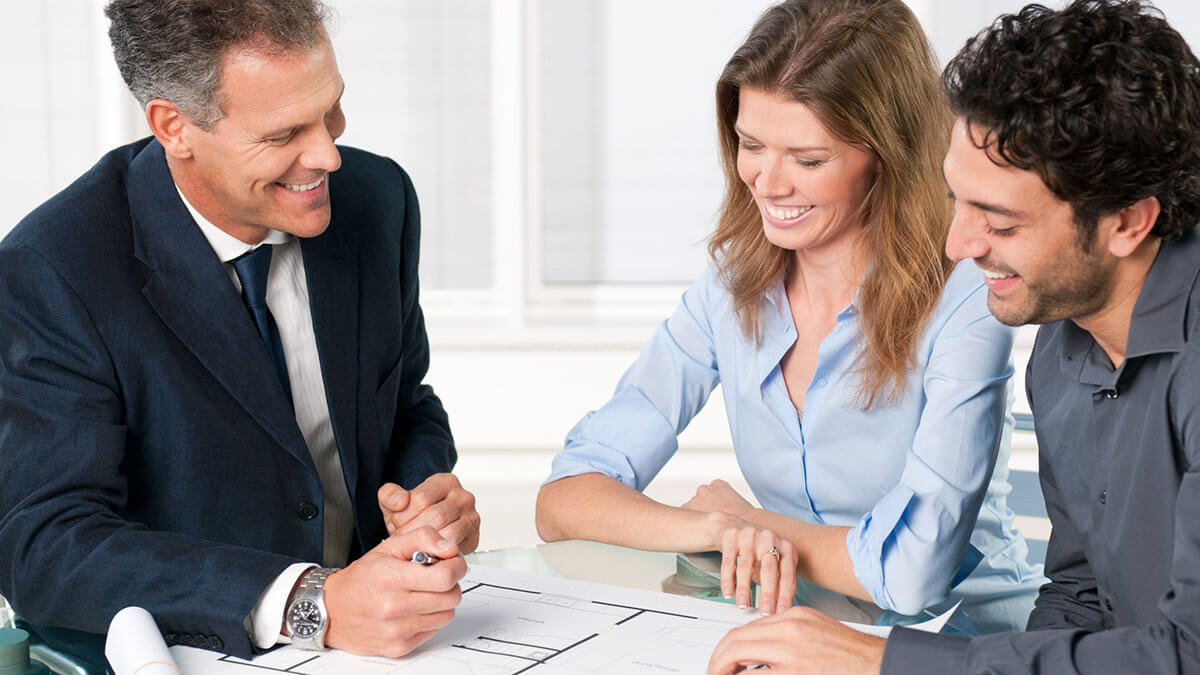 home sellers discussing over terms with a real estate transaction coordinator