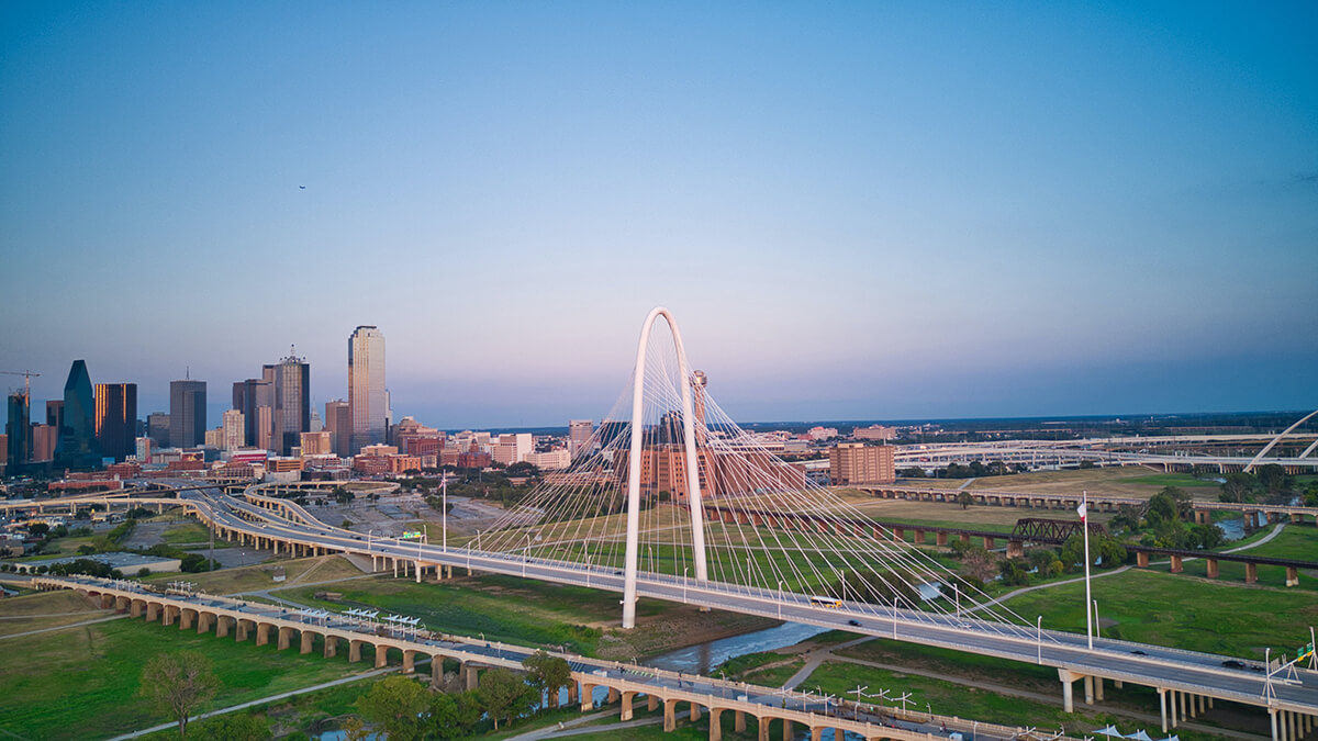 skyline of Margaret Hunt Hill Bridge and downtown Dallas on the left