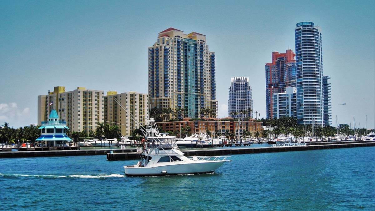 Miami apartment buildings with a boat in the foreground