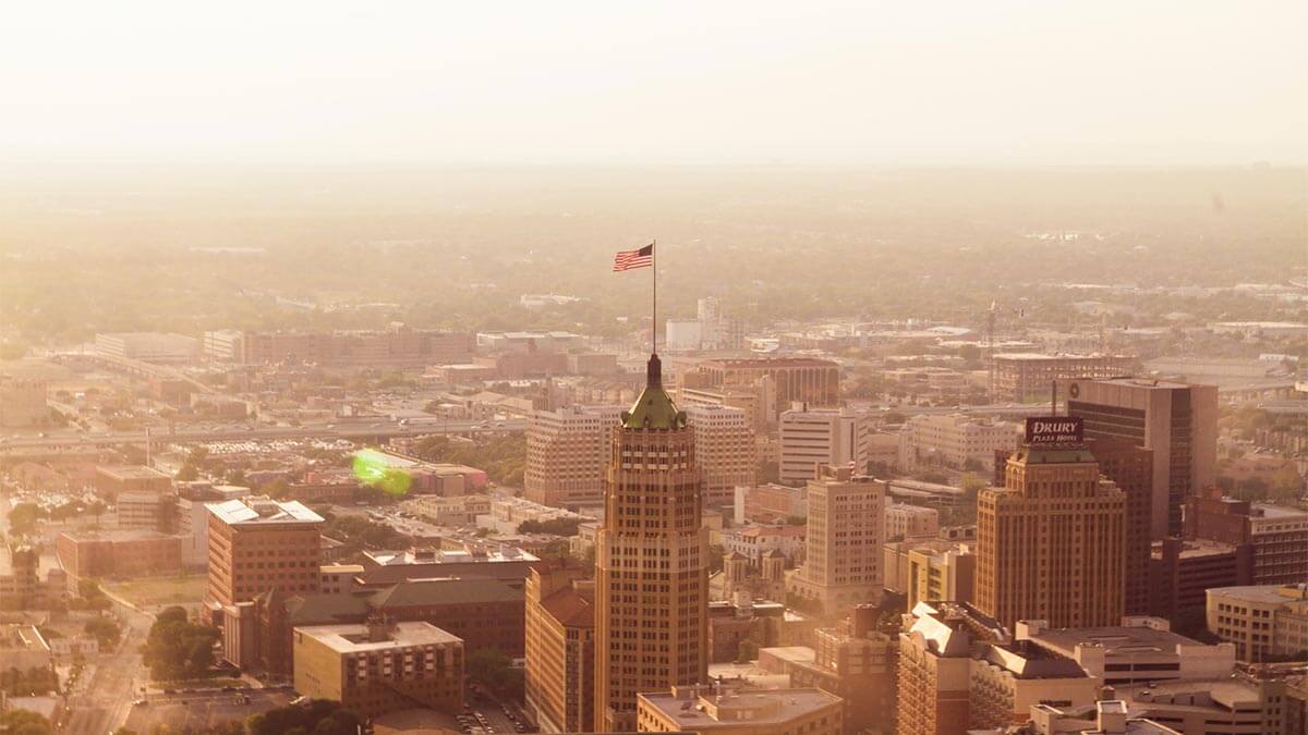 aerial view of downtown San Antonio, Texas with American Flag in the center