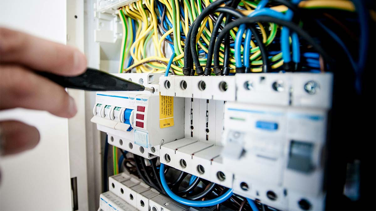 Do I need an electrician to replace hardwired smoke detectors